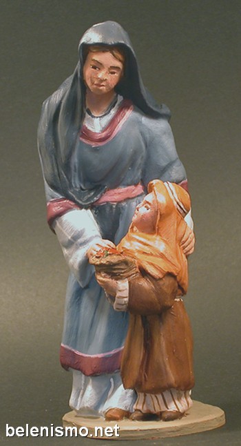 Pastora de camino con niña